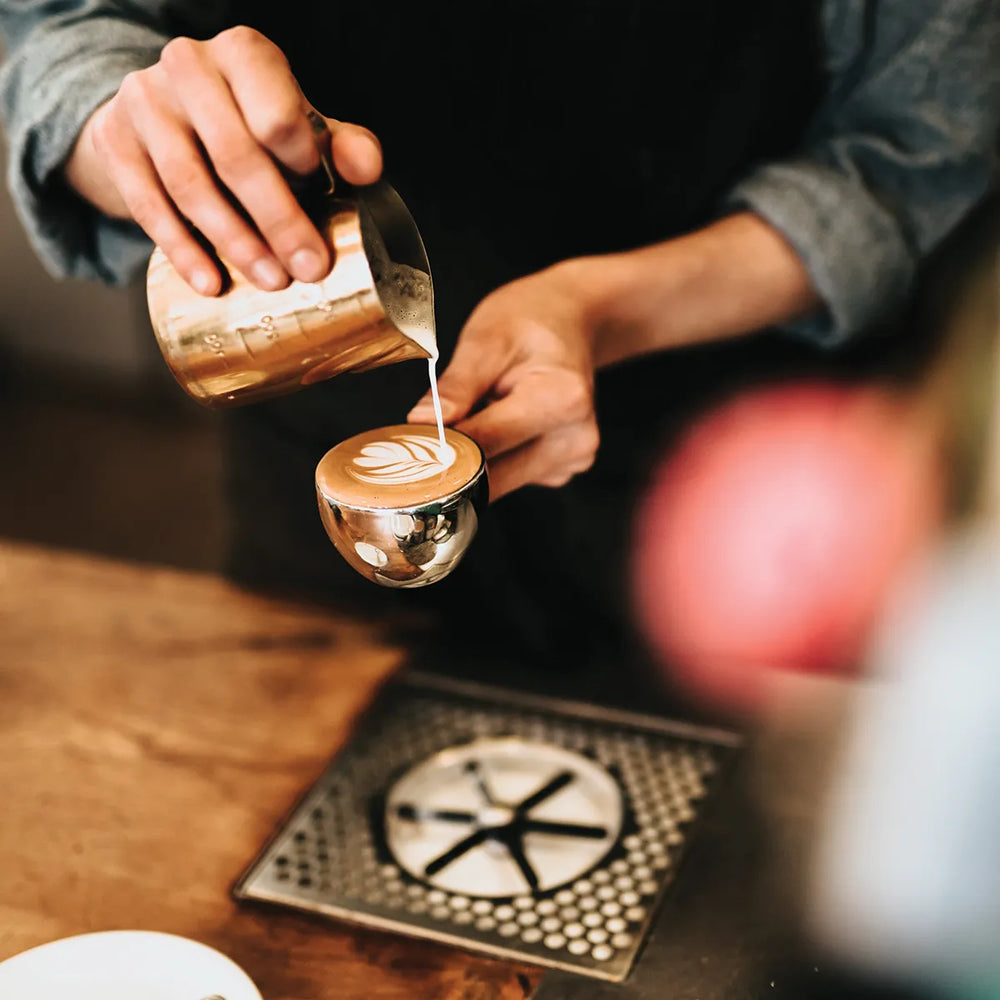 Ground Coffee Society wholesale coffee – barista serving coffee