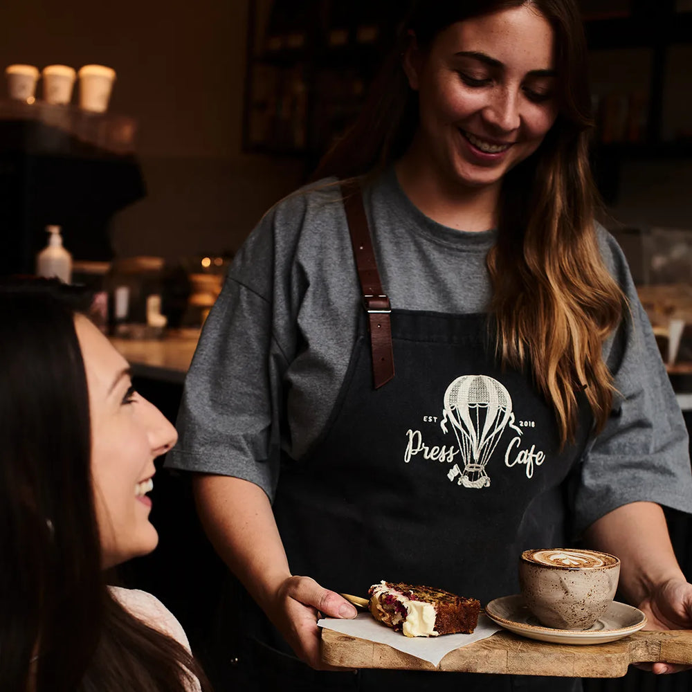 Ground Coffee Society wholesale coffee – barista serving coffee
